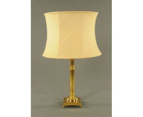 A 20th century brass table lamp, with shade. 73 cm overall.