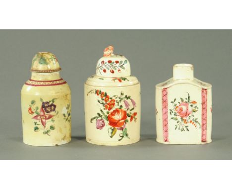 An 18th century creamware pottery cylindrical tea caddy, enamelled in colours with dog roses.  12 cm high, a similar cylindri
