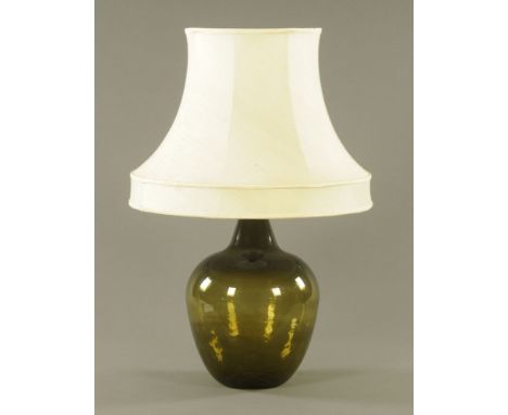 A small green glass carboy table lamp, 82 cm overall.  CONDITION REPORT: The bottle with flaked chip to rim otherwise appears