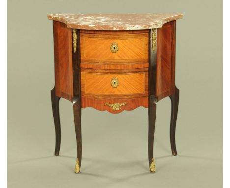 A continental marble topped serpentine two drawer commode, raised on cabriole legs, the front two terminating in sabot feet. 