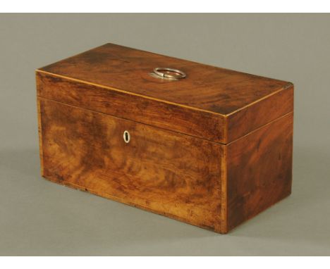 A George III figured mahogany rectangular tea caddy, inlaid with boxwood stringing and banding, the top with silver plated ov