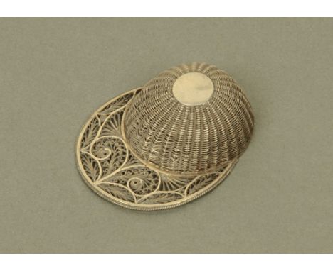 A 19th century filigree white metal jockey cap caddy spoon. CONDITION REPORT: This filigree jockey cap spoon has slight gappi