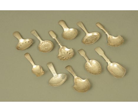 Ten George III and later silver caddy spoons by John Thropp or Joseph Taylor, displaying different patterns and styles, all h