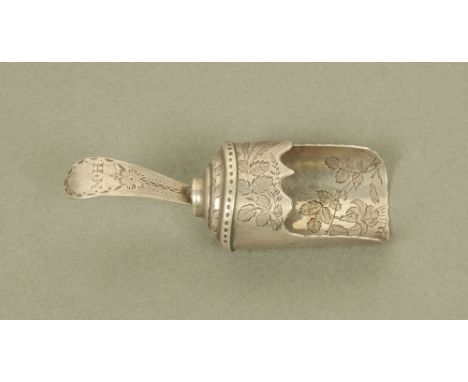 A George III silver shovel form caddy spoon, with floral engraving by Thomas Wallis II, London 1785. CONDITION REPORT: This s