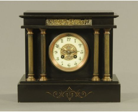 A 19th century French black slate mantle clock by Marti et Cie, of architectural design, the cream dial with Arabic numerals 