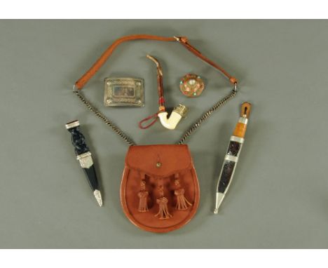 A collection of items to include a miniature Skean Dhu, 20 cm long, one other small dagger, 23 cm long, a leather sporran, a 