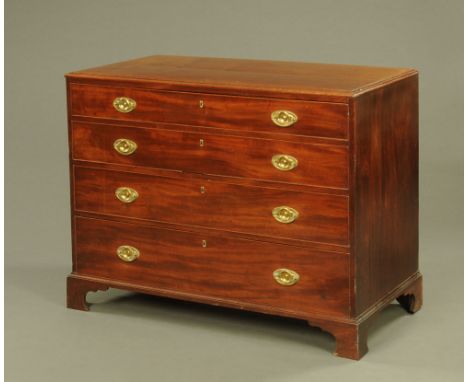 A 19th century mahogany chest of four graduated drawers, each cockbeaded and with oval brass backplates and bail type handles