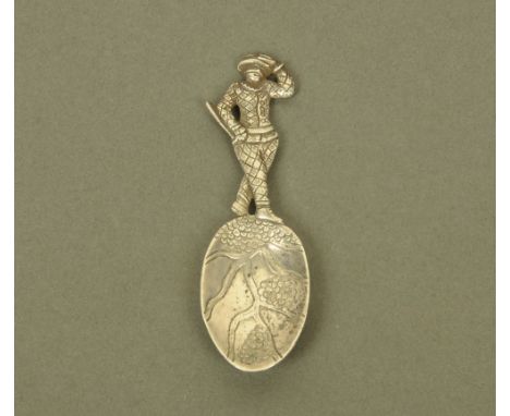 An early Victorian cast silver harlequin form caddy spoon, with figural terminal, the bowl decorated with fruiting vines by W