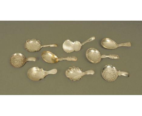 Eight George III and later silver caddy spoons by John Bettridge, displaying various styles and patterns, all with Birmingham