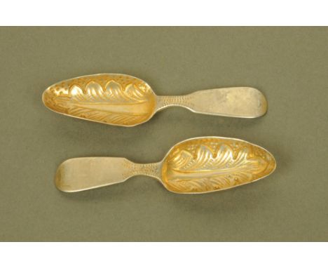 A pair of William IV silver gilt fiddle pattern caddy spoons with embossed leaf bowls by William Bateman, London 1834. CONDIT