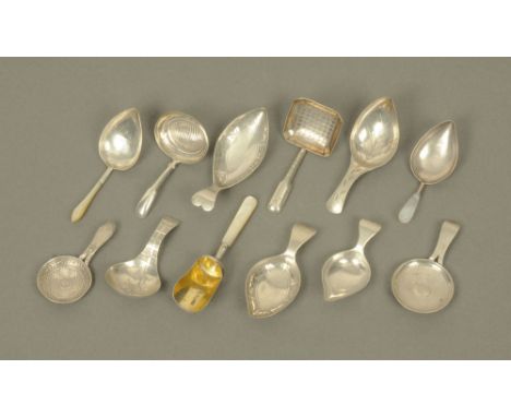 Twelve George III silver caddy spoons by William Pugh, displaying different designs and patterns including shovel form spoon 