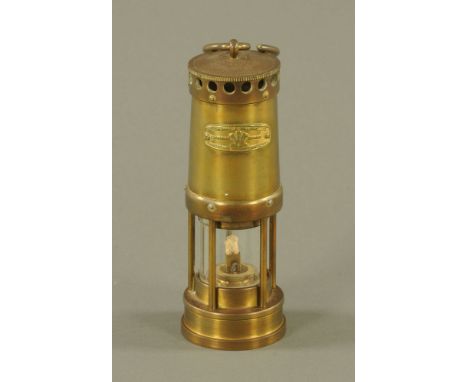 A vintage Welsh brass miners lamp, by E Thomas and Williams Ltd., 22 cm high.