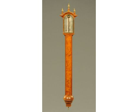 A Comitti of Holborn walnut cased stick barometer, with silvered dial and brass fittings.  Height 108 cm.