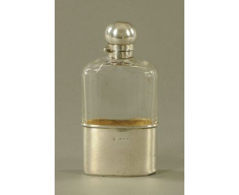 A Victorian silver mounted flask, London 1886.  Height 15.5 cm. CONDITION REPORT: The top snaps shut as it should.  When shut