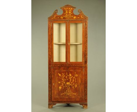 A 19th century foliate and bird marquetry Dutch corner cabinet, with shaped pediment and glazed upper doors enclosing a shelf