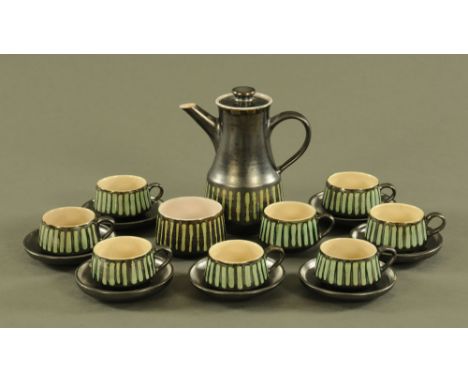 A stoneware coffee service, circa 1970, comprising coffeepot, eight cups, seven saucers and sugar basin.
