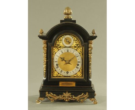 A 19th century ebonised bracket clock, with three train spring driven movement striking on five gongs, complete with key and 