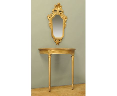 A gilt painted console table, demi lune raised on fluted tapered front legs with mirror above with shelf and scroll frame.  T