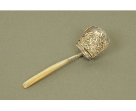 A George III silver shovel form caddy spoon by Thropp & Taylor, with floral embossed bowl and mother of pearl terminal, Birmi
