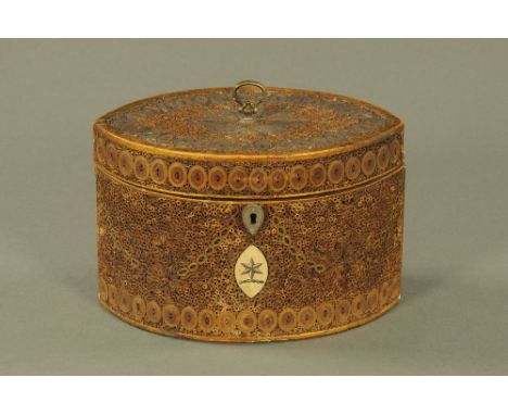 A rare George III rolled and gilded paper inlaid oval tea caddy, the front inset with engraved ivory oval cartouche and with 