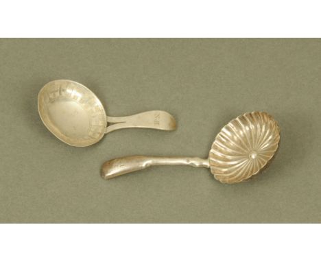 Two George III silver caddy spoons by William Pugh, both hallmarked for Birmingham for 1810 and 1814. CONDITION REPORT: These