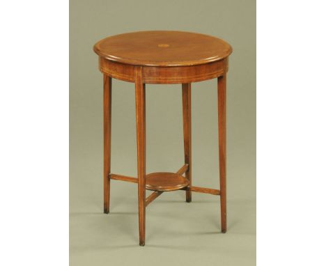 An Edwardian inlaid mahogany circular occasional table, the top with central sunburst motif over an X form stretcher with cir