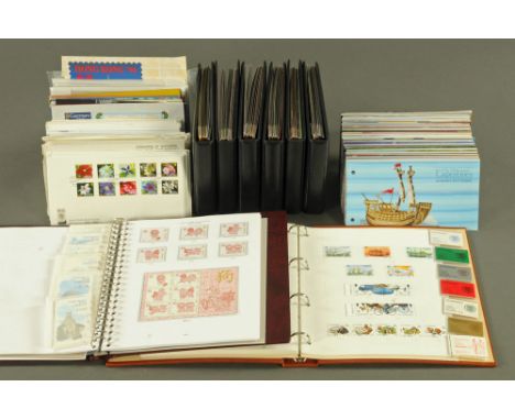 Eight albums of mint Guernsey stamps, and a collection of Guernsey First Day Covers and definitives, stamp books etc.