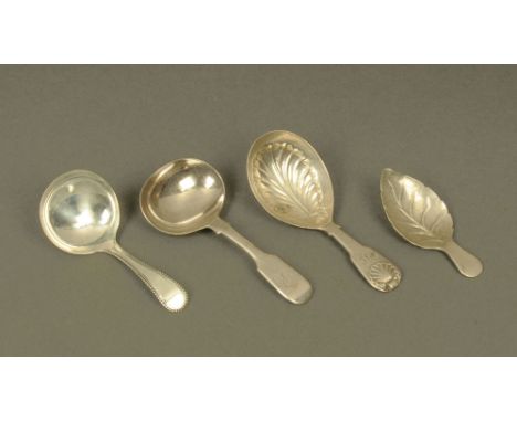 A William IV silver leaf pattern caddy spoon by Edward Barton, London 1831, two other silver caddy spoons, together with a si