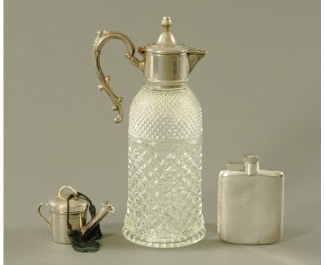 A moulded glass claret jug, with silver plated mount, a Parks of London candle holder in the form of a watering can together 