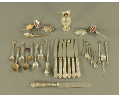 A collection of silver spoons, button hooks, Ricard bottle stops etc.