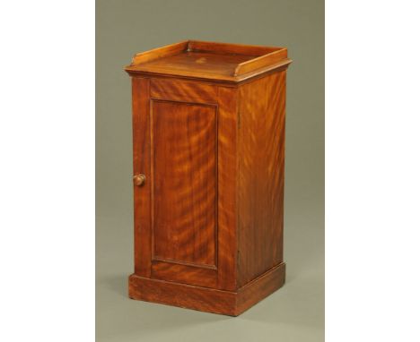 A Victorian mahogany bedside cabinet, with gallery and panelled door opening to a shelf.  Height 79 cm, width 39 cm, depth 37