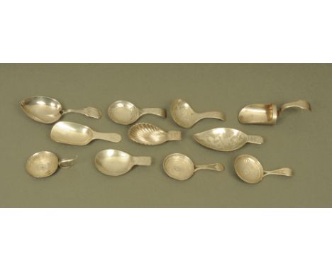 Eleven George III and later silver caddy spoons by Matthew Linwood, displaying different patterns and styles, all hallmarked 