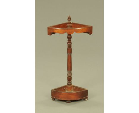 A Victorian mahogany bowfronted stick stand, with shaped frieze.  Height 87 cm, depth 31 cm. CONDITION REPORT: The stick stan