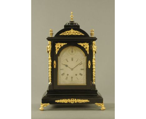 A large late Victorian ebonised three train spring driven bracket clock, with Cambridge and Westminster chimes striking on ei