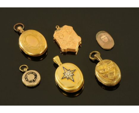 A Victorian gold coloured metal oval locket, the face with open cartouche, inset with a lock of hair and seed pearls.  4 cm x