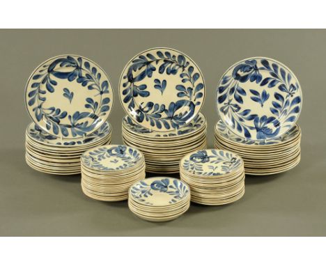 A continental blue and white pottery part dinner service decorated with leaves, comprising seven saucers, forty four 18 cm di