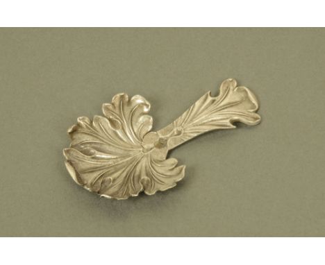 A William IV cast silver caddy spoon, by John Tongue of naturalistic flared leaf design, Birmingham 1831 (split). CONDITION R