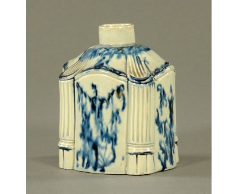 An 18th century pearlware pottery oval tea caddy of architectural design, with reeded columns to corners.  13 cm high. CONDIT