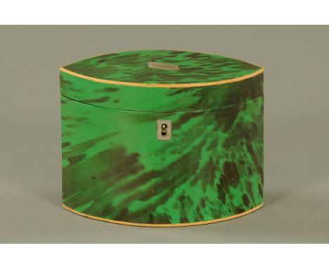 A George III green tortoiseshell oval tea caddy, the lid inset with engraved white metal rectangular cartouche.  11 cm high, 