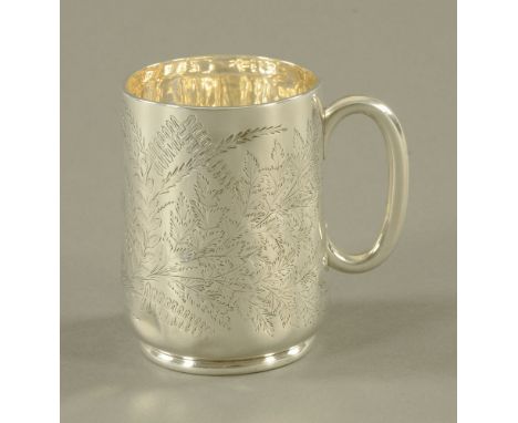 A Victorian silver christening mug, foliate engraved, London 1883, maker William Hutton & Son.  182.5 grams.  Height 10 cm. C