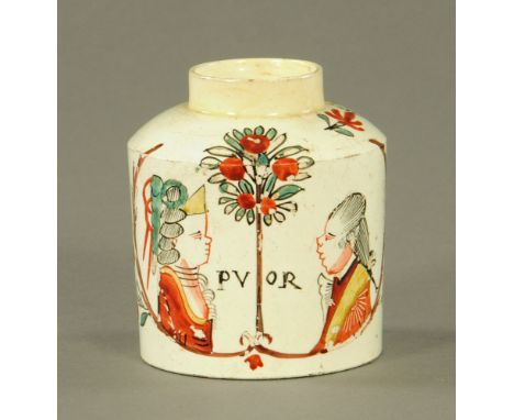 An 18th century Dutch creamware pottery "Marriage" tea caddy, decorated with male and female profiles and worded PV and OR, t
