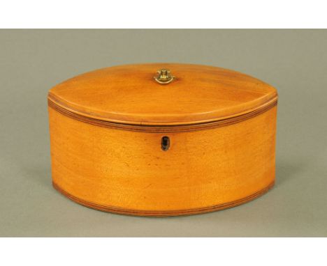 An early 19th century beechwood oval two division tea caddy, inlaid with mahogany and boxwood stringing.  12 cm high.