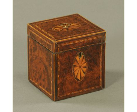 A George III figured walnut square tea caddy, inlaid with oval shell paterae and checkered bandings.  12 cm high.