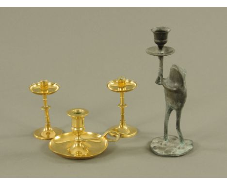 A 19th century polished brass chamberstick, with circular sconce and drip pan, 9 cm high, a pair of 19th century polished bra