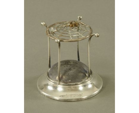 An Edwardian silver hat pin stand by Arthur Johnston Smith 1909, with spider, fly and cobweb top and stamped Registered 53526