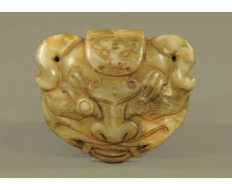 A Chinese carved jade buckle.  Width 9 cm.