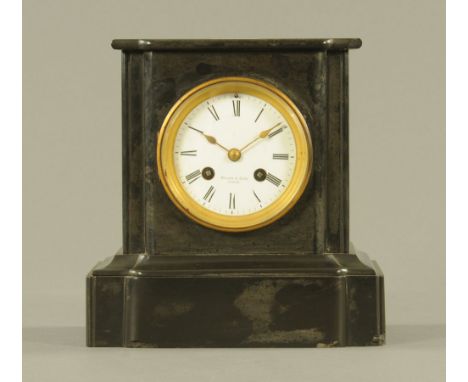A Victorian black slate mantle clock, the enamelled dial and movement marked for Miller and Sons, London, 23 cm, with key and