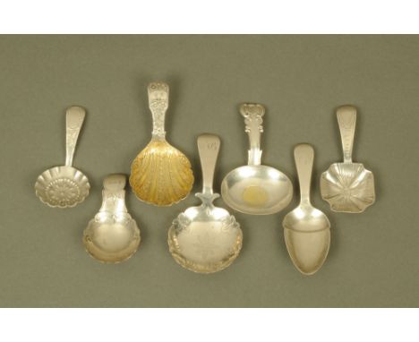 A George IV silver fiddle pattern caddy spoon by William Eaton, engraved throughout with flowers and with silver gilt scallop