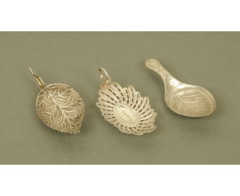 A George III silver leaf form caddy spoon by William Pugh, Birmingham 1804 and two other George III silver leaf form caddy sp