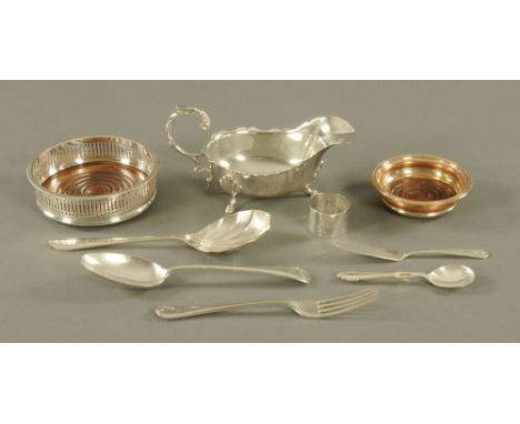 A silver plated sauce boat of large form, a plated decanter coaster, drinks coaster, plated spoon and fork, jam spoon, pickle